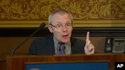 FILE - In this image taken from a video, economist Sean Turnell speaks at the Lowy Institute in Sydney, Australia, Nov. 28, 2013. The Myanmar junta has revoked its pardon of Turnell, who was granted amnesty and deported last November.