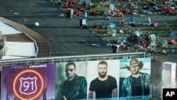 FILE - Personal belongings and debris litter the Route 91 Harvest festival grounds across the street from the Mandalay Bay resort and casino in Las Vegas on Oct. 3, 2017, after a mass shooting Oct. 1. (AP Photo/Marcio Jose Sanchez, File)