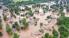 Flooded homes are seen along the Arkansas River in Sand Spring, Okla., in this May 28, 2019, aerial photo.