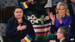 Ukraine Ambassador to the United States, Oksana Markarova, acknowledges President Joe Biden as first lady Jill Biden applauds during his first State of the Union address to a joint session of Congress, at the Capitol in Washington, March 1, 2022.