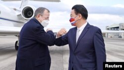 Mike Mullen, former chairman of the U.S. Joint Chiefs of Staff greets Taiwan Foreign Minister Joseph Wu as he and other members of the U.S. delegation arrive at Taipei Songshan airport in Taipei, Taiwan March 1, 2022.