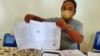 Ketua Badan Permusyawaratan Desa (BPD) Citemu, Mundu, Cirebon Lukman Nurhakim menunjukkan surat laporan Nurhayati. (Foto: Lukman Nurhakim)