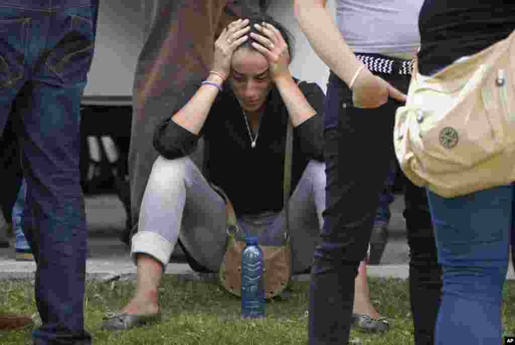 Relatives of the victims involved in the train accident react at a victims' information point in Santiago de Compostela, Spain, July 25, 2013. 
