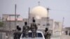FILE - Syrian Democratic Forces are seen in Raqqa, Syria, July 31, 2017.