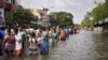 Floodwaters Swirl in South India Even as Rain Eases