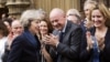 British Officials, Buckingham Palace Scramble to Crown Theresa May