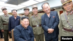 North Korean leader Kim Jong Un guides the test firing of a new weapon, in this undated photo released Aug. 11, 2019 by North Korea's Korean Central News Agency.