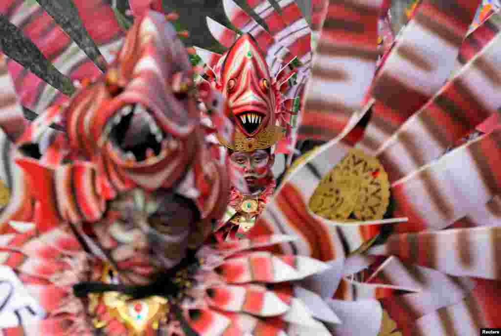 Balinese artists dressed in decorative costumes take part in the Maritime Festival at Pandawa Beach on the resort island of Bali, Indonesia.