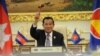 Cambodian Prime Minister Hun Sen holds the ceremonial gavel in a virtual meeting as Cambodia takes over the ASEAN chairmanship, from Brunei, on Thursday, October 28, 2021.