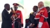 FILE - Tanzania's President-elect John Magufuli (L) takes the Oath of Office during his inauguration ceremony at the Uhuru Stadium in Dar es Salaam, Nov. 5, 2015. 