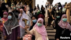 Muslims celebrate Eid al-Fitr, the Muslim festival marking the end of the holy fasting month of Ramadan, at the Thai Islamic Center amid the spread of the coronavirus disease (COVID-19) outbreak in Bangkok, Thailand, May 24, 2020. 