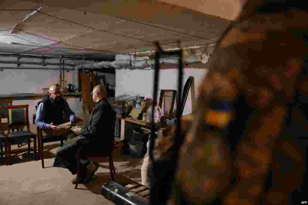 President of the European Council Charles Michel, left, sits in a bomb shelter during his meeting with Ukrainian Prime Minister Denys Shmygal, in Odessa, Ukraine, in this handout picture released by the European Council.