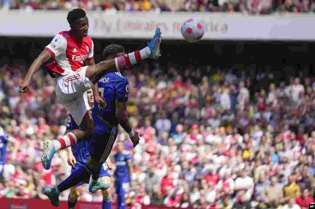 Arsenal's Eddie Nketiah, left, controls the ball during the English Premier League soccer match between Arsenal and Leeds United at the Emirates Stadium in London.