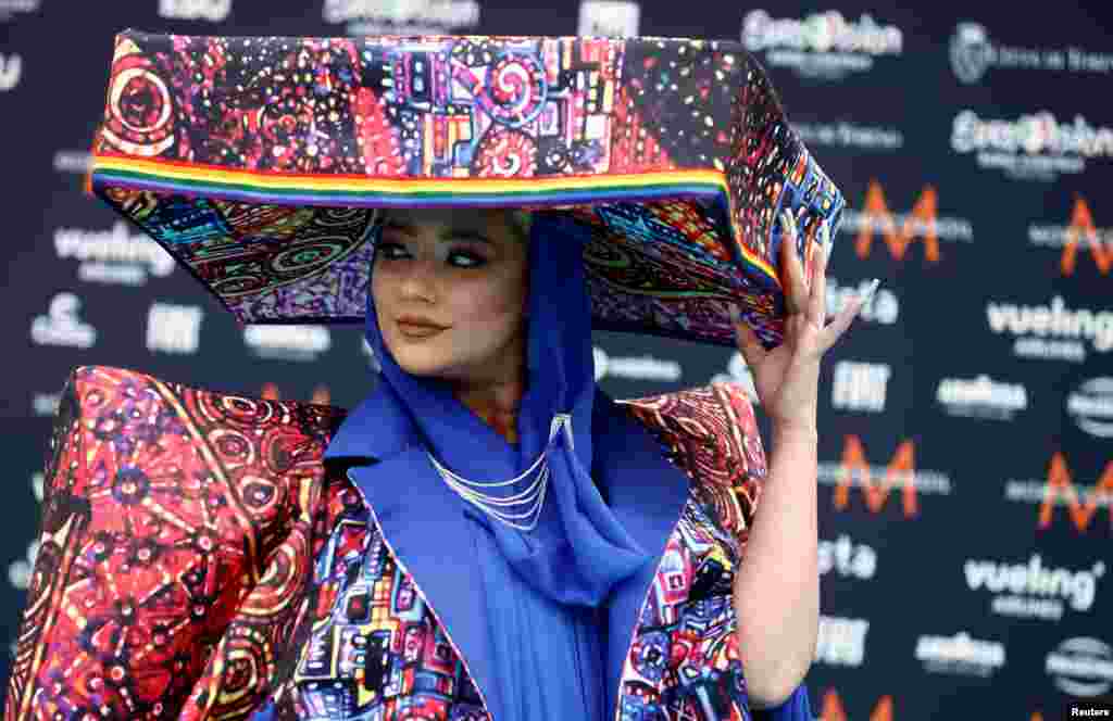 Contestant Ronela Hajati poses on the "Turquoise Carpet" during the opening ceremony of the 2022 Eurovision Song Contest in Turin, Italy.