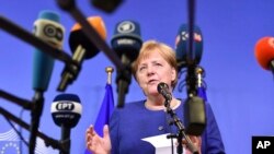 Kansela wa Ujerumani, Angela Merkel, akizungumza na waandishi wa habari. Juni 24, 2018.