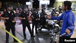 A man speaks to LAPD officers during a demonstration against the grand jury's decision in the Ferguson, Missouri shooting of Michael Brown, in Los Angeles, California November 28, 2014. 