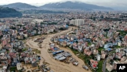 In this aerial image of the Kathmandu valley, the Bagmati River is seen flooding due to heavy rains in Kathmandu, Nepal, Sept. 28, 2024.