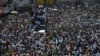 Protesters led by the art community demand the resignation of Haitian President Jovenel Moise as they march through Port-au-Prince, Haiti, Oct. 13, 2019.