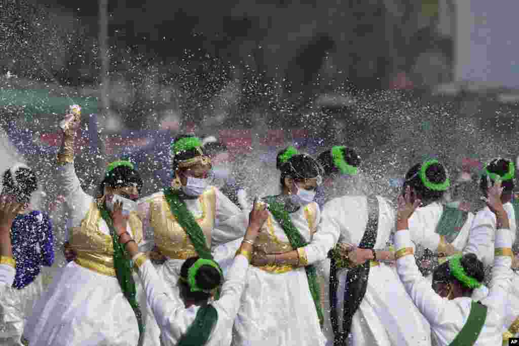School girls dance during India's Republic Day celebrations in Jammu.
