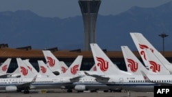 រូបឯកសារ៖ យន្ដហោះ Air China ចត​នៅ​ឯ​អាកាស​យានដ្ឋាន​ក្នុង​រដ្ឋធានី​ប៉េកាំង កាលពី​ថ្ងៃទី២៧ ខែមីនា ឆ្នាំ២០២០។
