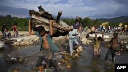 Bato bayike bazali kokatisa wuta San Antonion na Venezuela mpo na kokende Cucuta na Colombia. le 3 mai 2019.