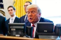 President Donald Trump speaks while on a phone call with the leaders of Sudan and Israel in the Oval Office of the White House, Oct. 23, 2020, in Washington.