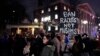 Several hundred people march past the gates of Harvard Yard at Harvard University while protesting the travel ban in Cambridge, Mass., March 7, 2017. 
