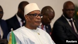 FILE - Mali's President Ibrahim Boubacar Keita attends the summit of the Heads of state from the eight-nation West African Economic and Monetary Union (UEMOA) in Abidjan, Ivory Coast, July 12, 2019.