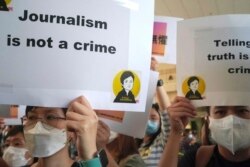 Press freedom advocates rally outside a court in Hong Kong on April 22, 2021.