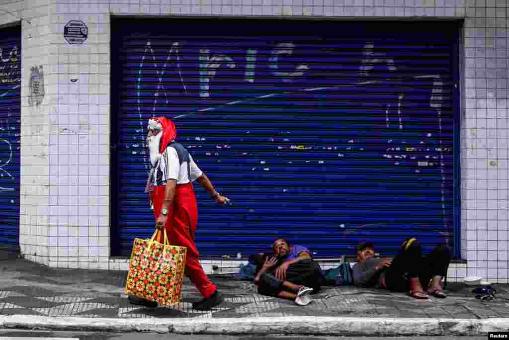 A man dressed as Santa Claus, who identifies as "Sultan Das Matas," walks, in Sao Paulo, Brazil, Dec. 9, 2024.