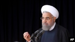 In this photo released by official website of the office of the Iranian Presidency, President Hassan Rouhani speaks to a crowd during a visit to the central city of Arak, Oct. 23, 2016.