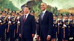 Chinese President Xi Jinping, left, and U.S. President Obama in a welcome ceremony at the Great Hall of the People in Beijing, China Nov. 12, 2014. The U.S. hosts President Jinping this week. (AP Photo/Andy Wong)
