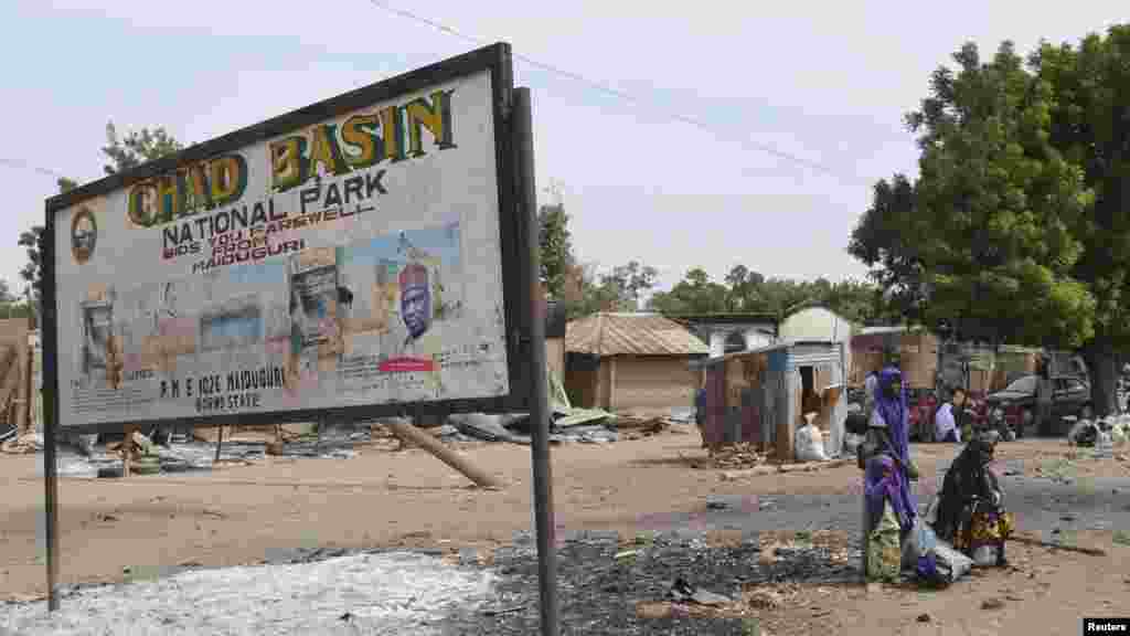 Wasu gidaje da aka kona a harin da ake zaton ‘yan Boko Haram ne suka kaishi a Kawuri dake Maiduguri, Junairu 28, 2014.