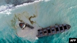 This aerial picture taken on August 16, 2020, shows the MV Wakashio bulk carrier that had run aground and broke into two parts near Blue Bay Marine Park, Mauritius. 