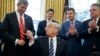 After Flurry of Executive Orders, Trump Awaits More Fancy Pens
