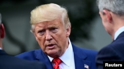 U.S. President Donald Trump speaks as he meets with sheriffs from across the country on the South Lawn of the White House in Washington, U.S., September 26, 2019.