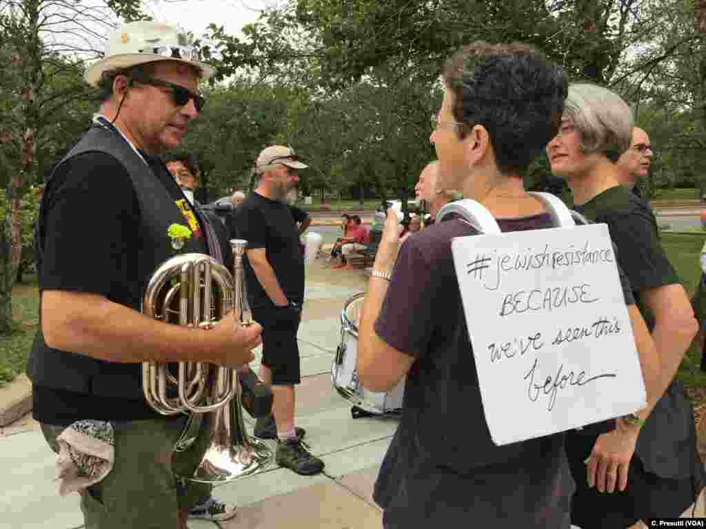 The Boston Area Brigade of Activist Musicians aka BABAM will march with the counterprotestors. Rebecca Gorlin wears a sign on her back about Jewish resistance as she plans to march playing her snare drum.