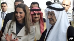 FILE - Saudi Prince Talal bin Abdel Aziz, right, and Queen Rania of Jordan, left, attends the opening ceremony of the Arab Open University, Jordan branch, in Amman, Jordan, Wednesday, Feb. 24, 2010. 