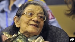 In this photo taken on Oct. 19, 2011 released by the Extraordinary Chambers in the Courts of Cambodia, Ieng Thirith smiles during a hearing in Phnom Penh.