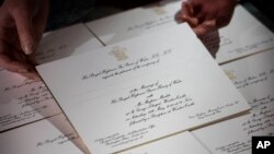 Invitations for Prince Harry and Meghan Markle's wedding in May, after they have been printed at the workshop of Barnard and Westwood in London, March 22, 2018.