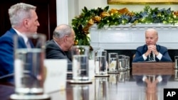 FILE - President Joe Biden, right, speaks at a meeting with congressional leaders in the Roosevelt Room of the White House in Washington, Nov. 29, 2022. Kevin McCarthy, now House Majority leader, is at left.
