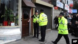 Police outside a property in Birmingham, England, March 23, 2017, following an attack on Wednesday in London.