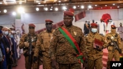 FILE - Lieutenant-Colonel Paul-Henri Sandaogo Damiba, President of Burkina Faso, arrives to his inauguration ceremony as President of Transition, in Ouagadougou, on March 2, 2022.