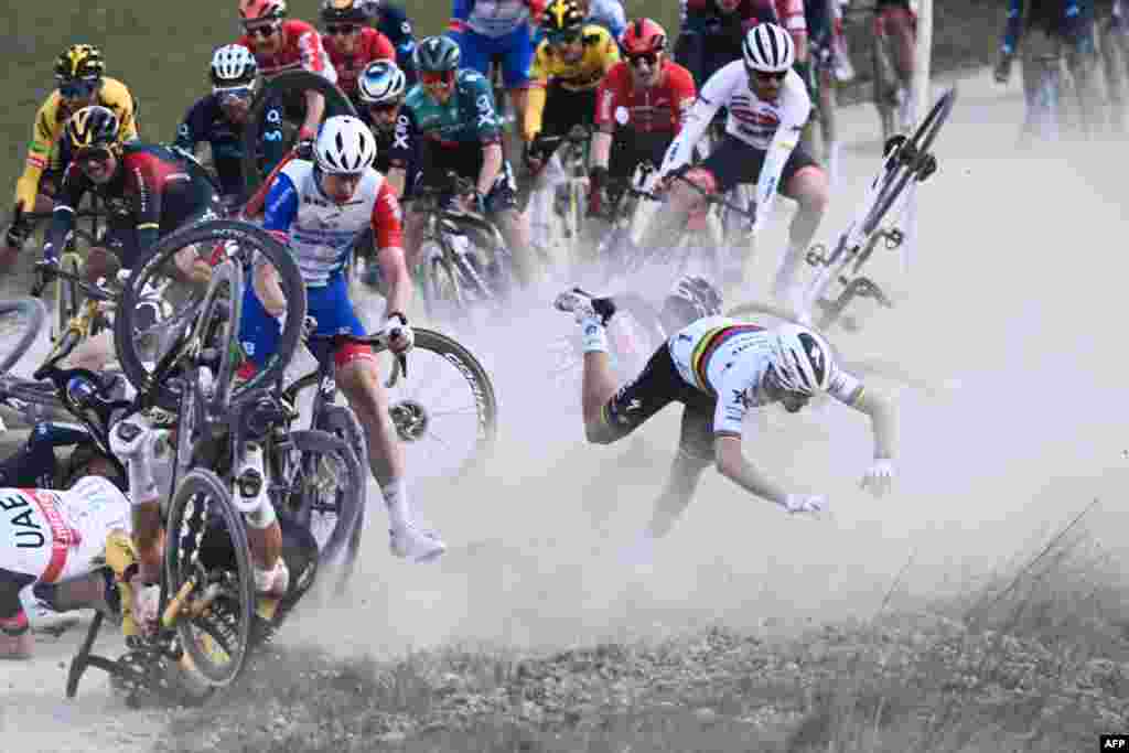 QuickStep - AlphaVinyl French rider Julian Alaphilippe (R) falls during the 16th one-day classic cycling race Strade Bianche (White Roads), 184 km between Siena and Siena, in Italy, March 5, 2022.