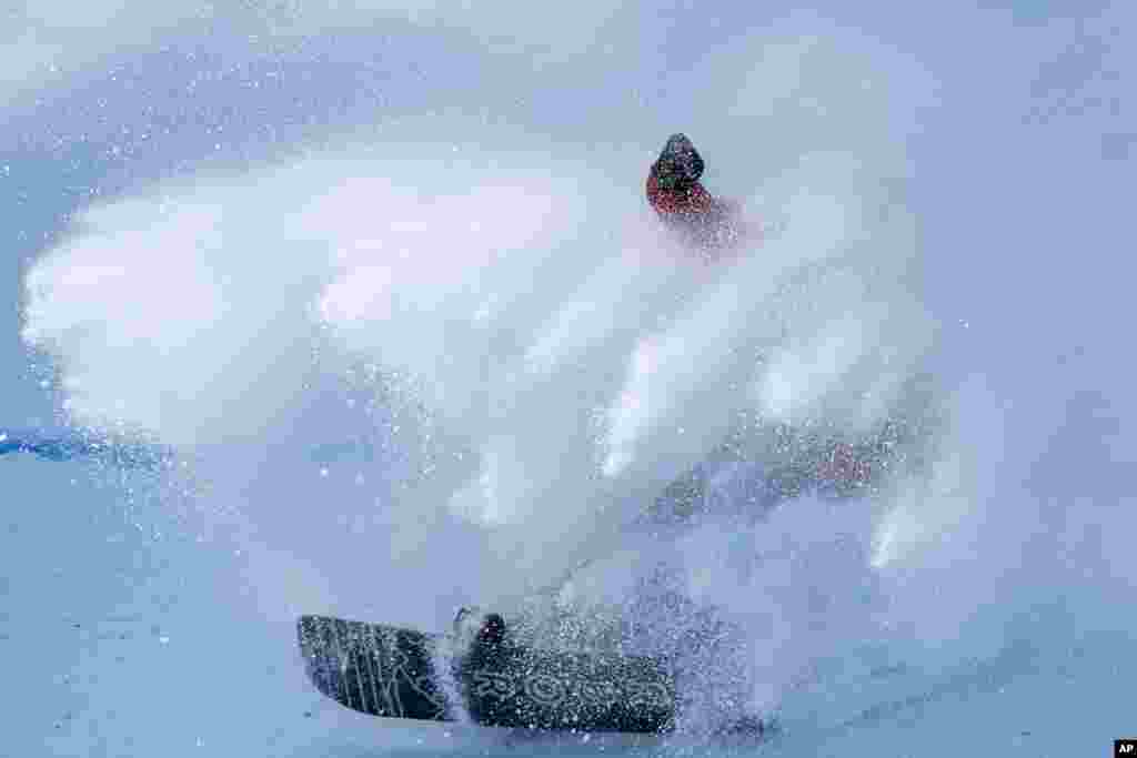 Niek van der Velden of the Netherlands crashes as he lads during the men's snowboard big air finals of the 2022 Winter Olympics in Beijing.