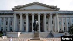 FILE PHOTO: A man walks away from the U.S Treasury Department in Washington.