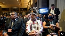 Audience members listen as President Joe Biden speaks at the White House Tribal Nations Summit at the Department of the Interior in Washington, Nov. 30, 2022.