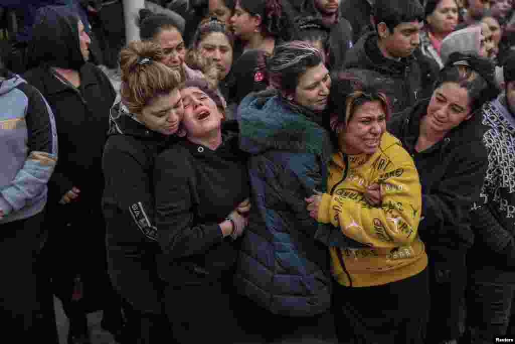 Relatives and friends mourn during the funeral procession of Costas Fragoulis, a 16-year old Roma who was fatally shot by police, in Thessaloniki, Greece.
