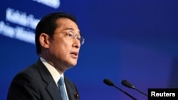 Japan's Prime Minister Fumio Kishida delivers the keynote address at the opening dinner of the 19th Shangri-La Dialogue in Singapore, June 10, 2022. 
