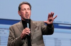 FILE - Larry Ellison, co-founder and chief executive officer of Oracle Corp., waits to meet with then-Japanese Prime Minister Shinzo Abe at the prime minister's official residence in Tokyo, Apr. 8, 2014.